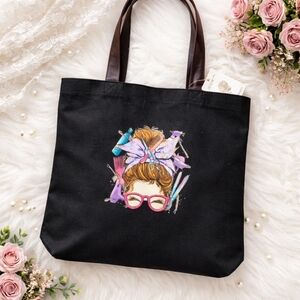 Chic Black Tote with Vibrant Hair Tools Design